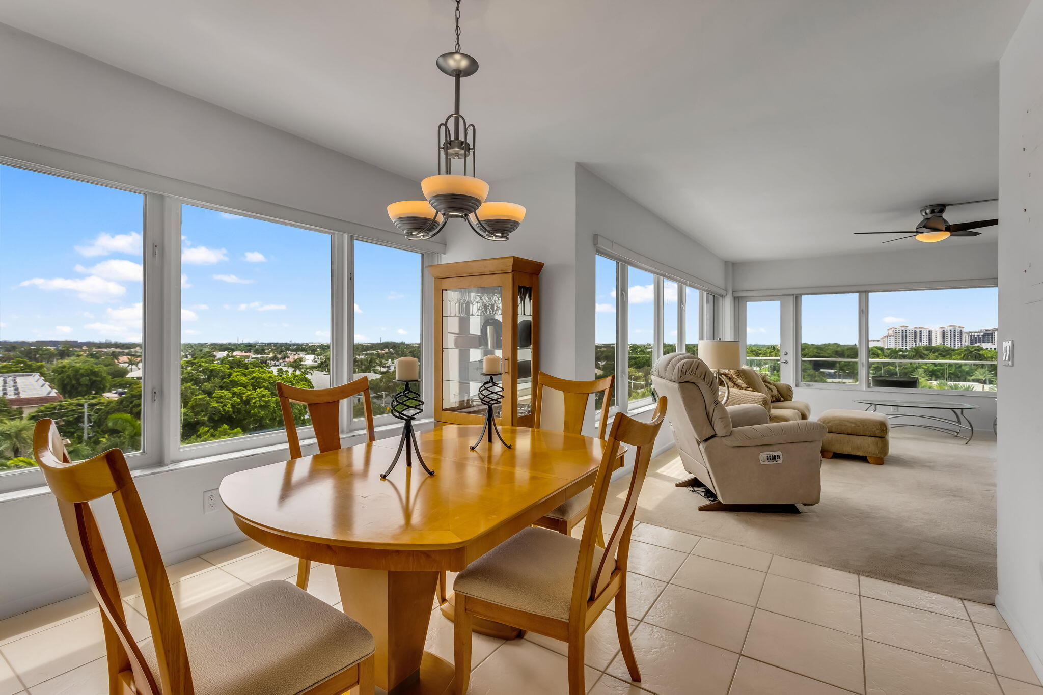 701 East Camino Real, Unit 8F Boca Raton, FL 33432 - Photo 32 of 54 a view of a dining room with furniture window and outside view