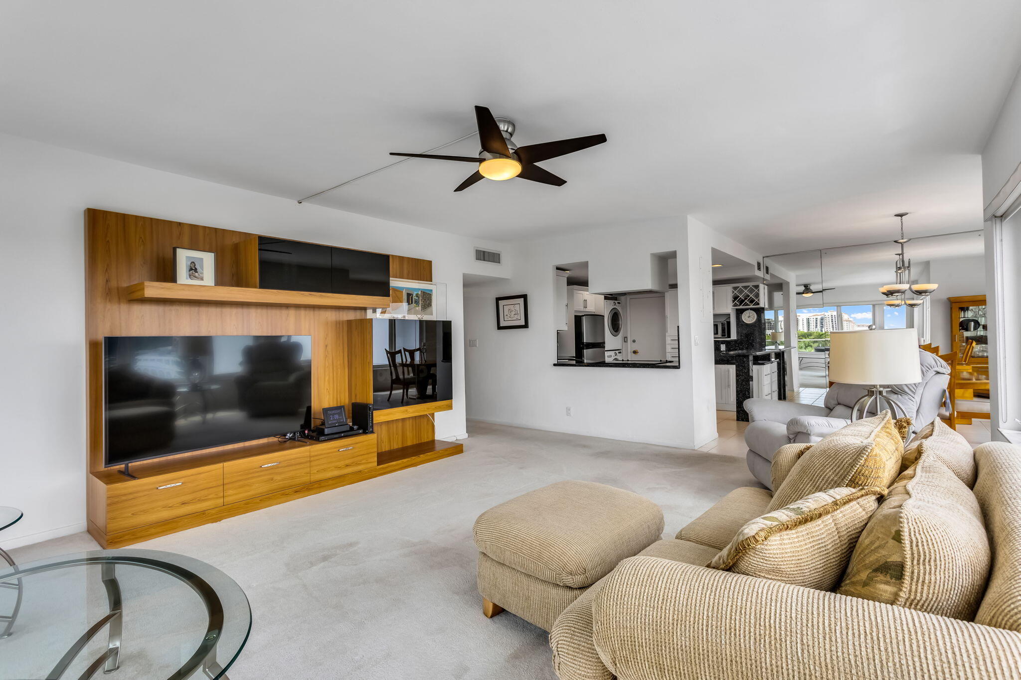701 East Camino Real, Unit 8F Boca Raton, FL 33432 - Photo 37 of 54 a living room with furniture and a flat screen tv