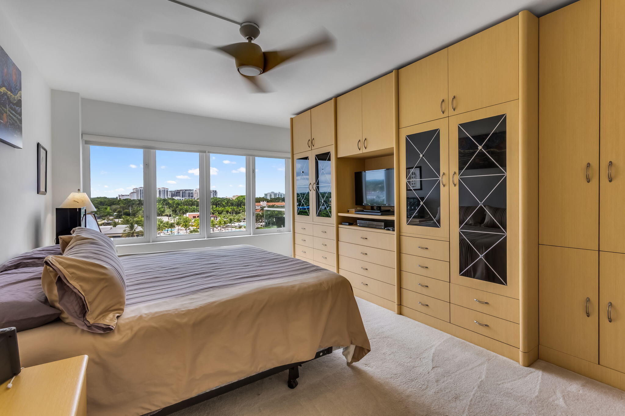 701 East Camino Real, Unit 8F Boca Raton, FL 33432 - Photo 41 of 54 a bedroom with a bed and walk in closet