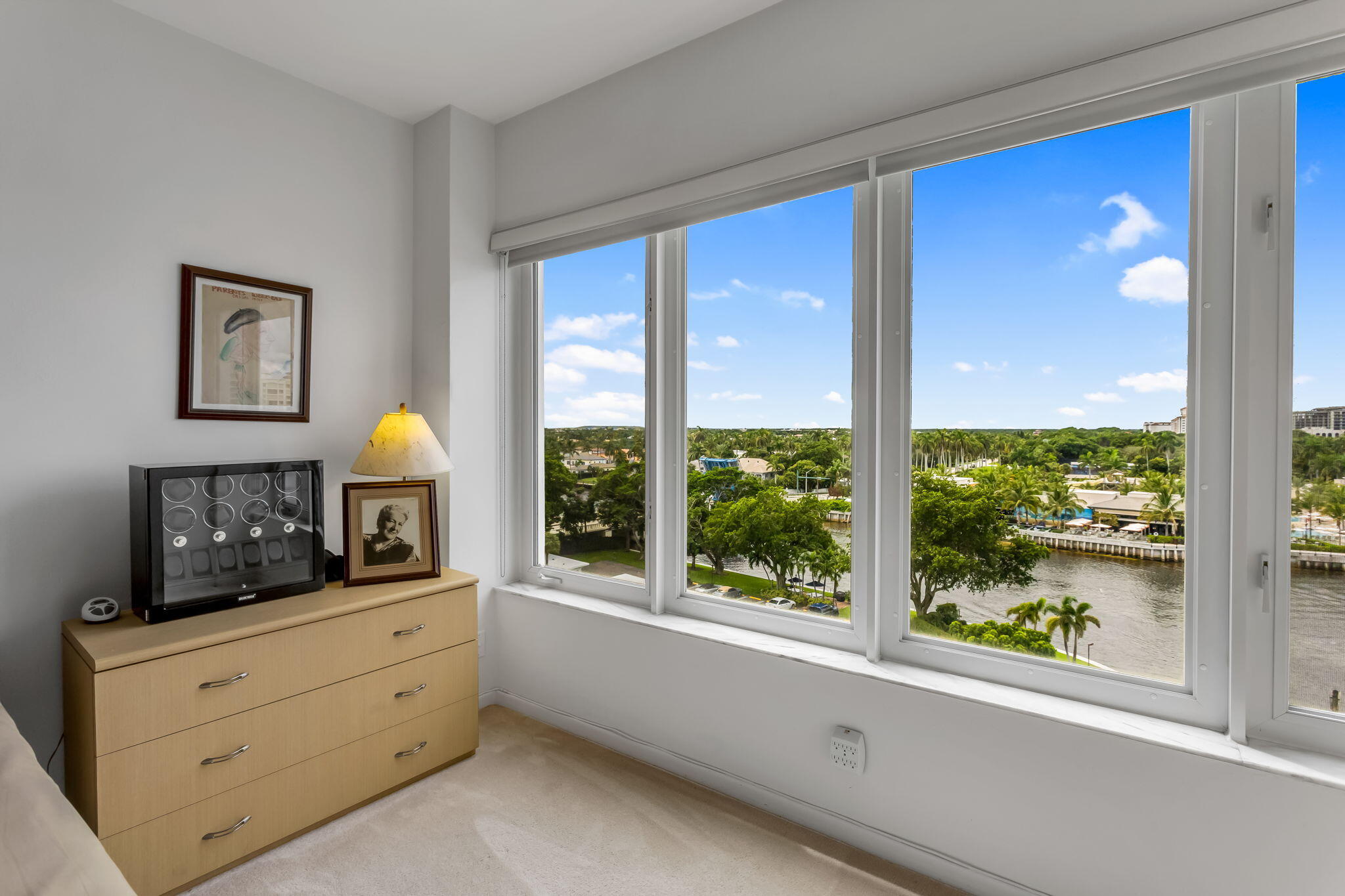 701 East Camino Real, Unit 8F Boca Raton, FL 33432 - Photo 43 of 54 a view of a bedroom with a large window and a fireplace
