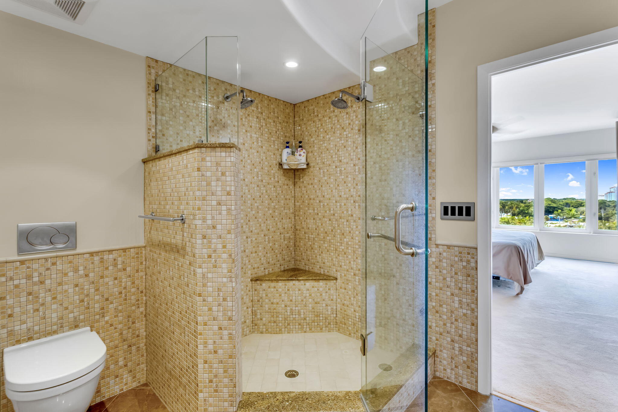 701 East Camino Real, Unit 8F Boca Raton, FL 33432 - Photo 47 of 54 a bathroom with a shower a toilet and a shower