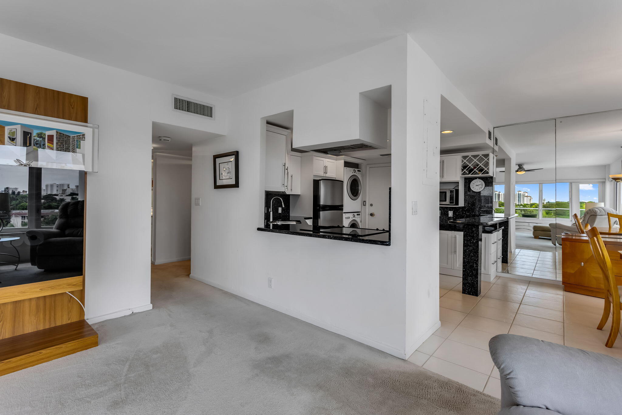 701 East Camino Real, Unit 8F Boca Raton, FL 33432 - Photo 51 of 54 a view of living room kitchen and stainless steel appliances