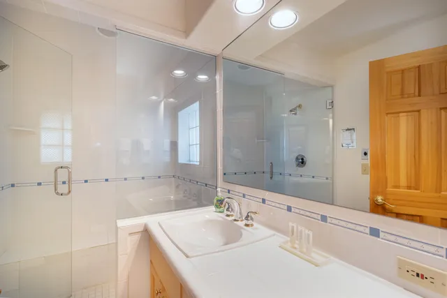 a bathroom with a bathtub and a shower