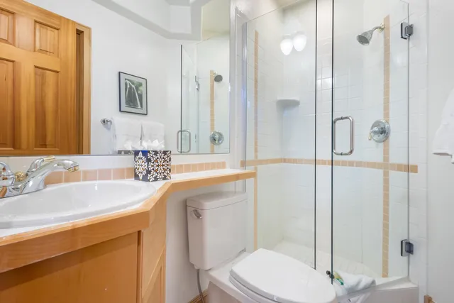 an empty room with windows and cabinet