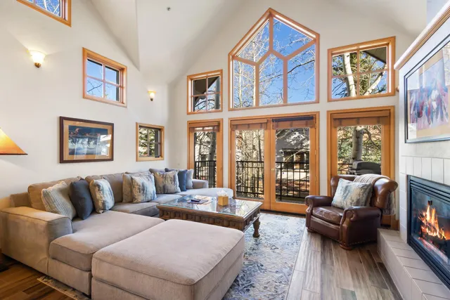 a view of a porch with wooden floor and furniture