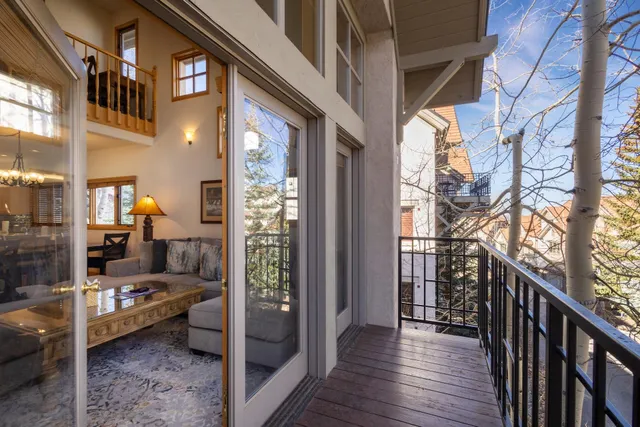 a kitchen with lots of counter top space sink dining table and chairs