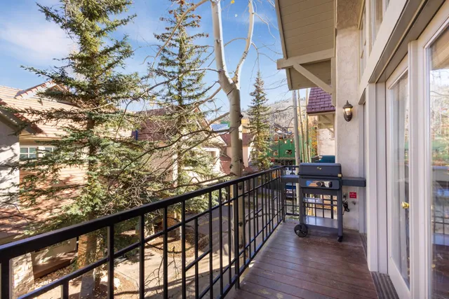 a bedroom with a bed and wooden cabinets