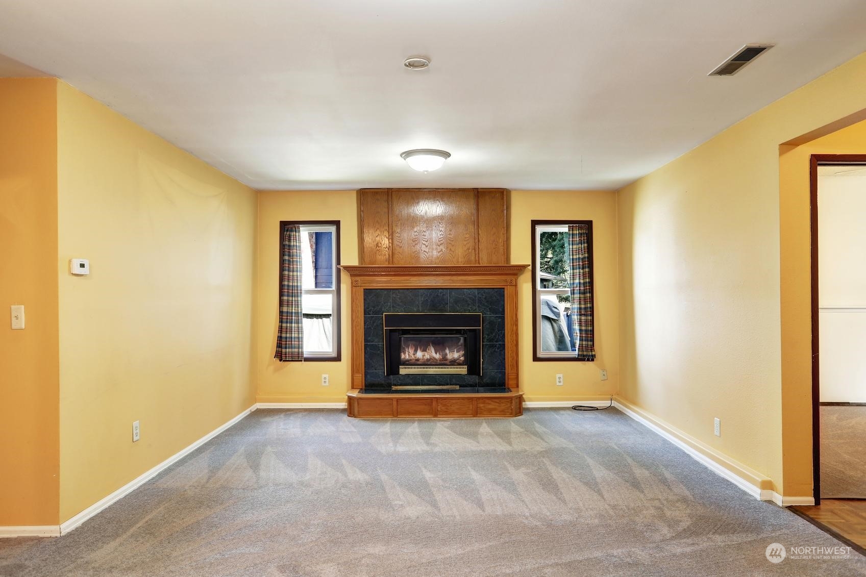 18636 111th Place Southeast Renton, WA 98055 - Photo 15 of 21 a view of a livingroom with a fireplace