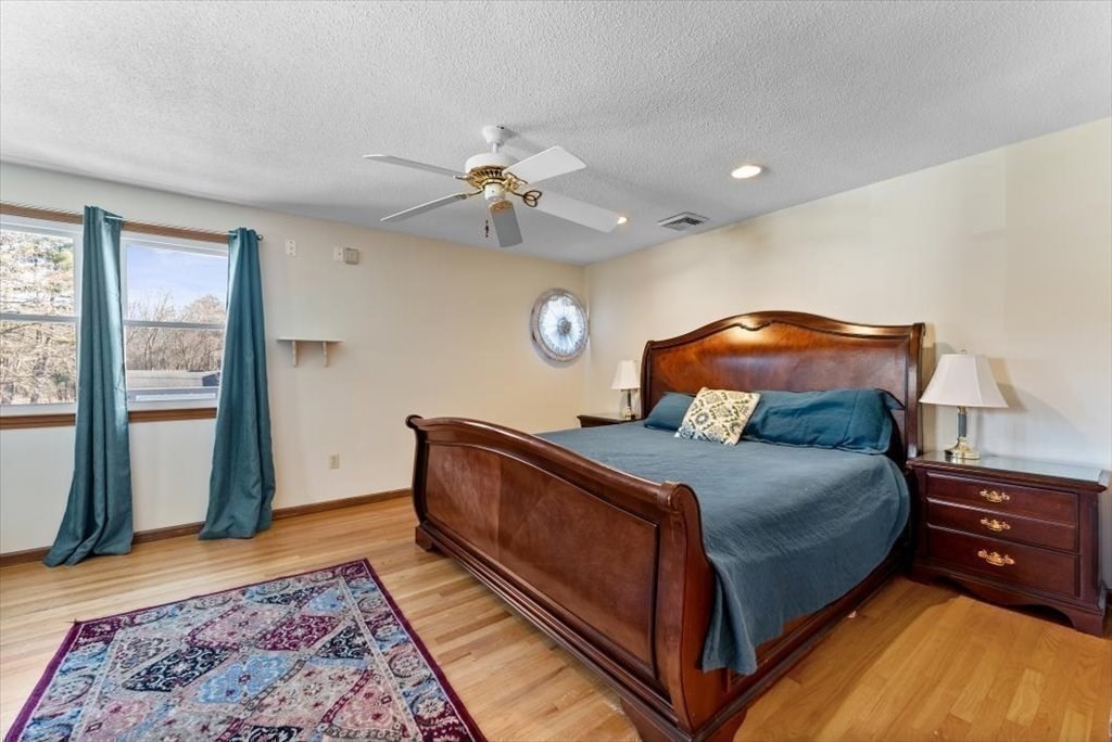 38 Blacksmith Road Wilbraham, MA 01095 - Photo 22 of 39 a bed room with a bed and a window