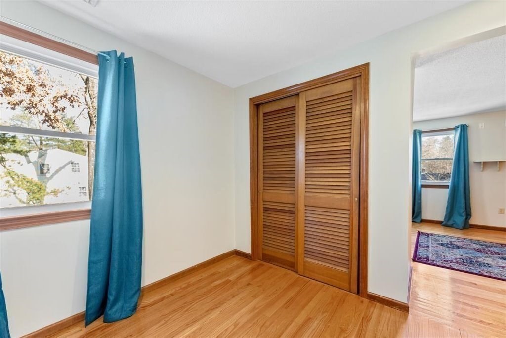 38 Blacksmith Road Wilbraham, MA 01095 - Photo 24 of 39 an empty room with wooden floor and windows