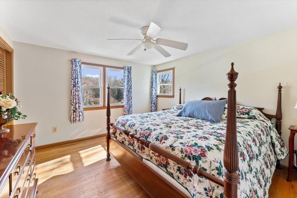 38 Blacksmith Road Wilbraham, MA 01095 - Photo 27 of 39 a bedroom with a bed chandelier and a window