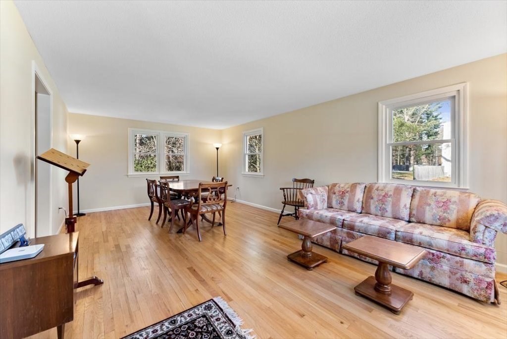 38 Blacksmith Road Wilbraham, MA 01095 - Photo 4 of 39 a living room with furniture and a wooden floor