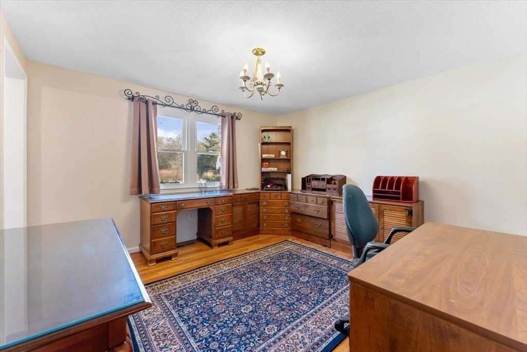 38 Blacksmith Road Wilbraham, MA 01095 - Photo 5 of 39 a living room with furniture and a rug
