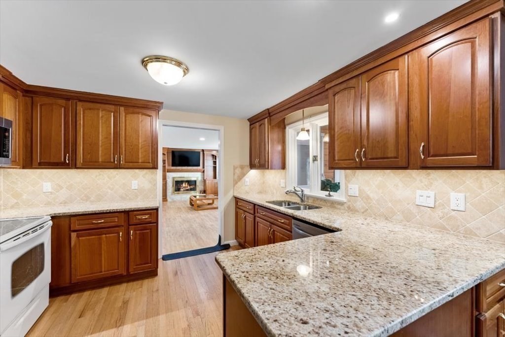 38 Blacksmith Road Wilbraham, MA 01095 - Photo 10 of 39 a kitchen with stainless steel appliances granite countertop wooden cabinets a stove and a sink