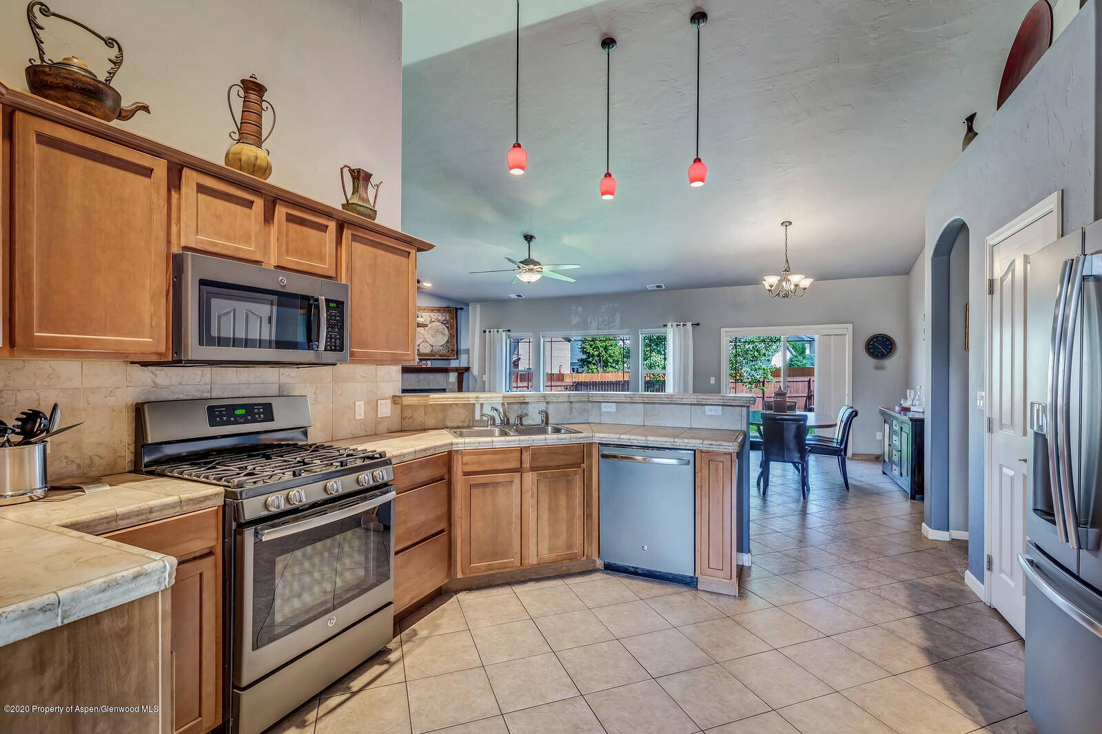 952 East 18th Street Rifle, CO 81650 - Photo 12 of 26 a kitchen with lots of counter top space appliances and cabinets