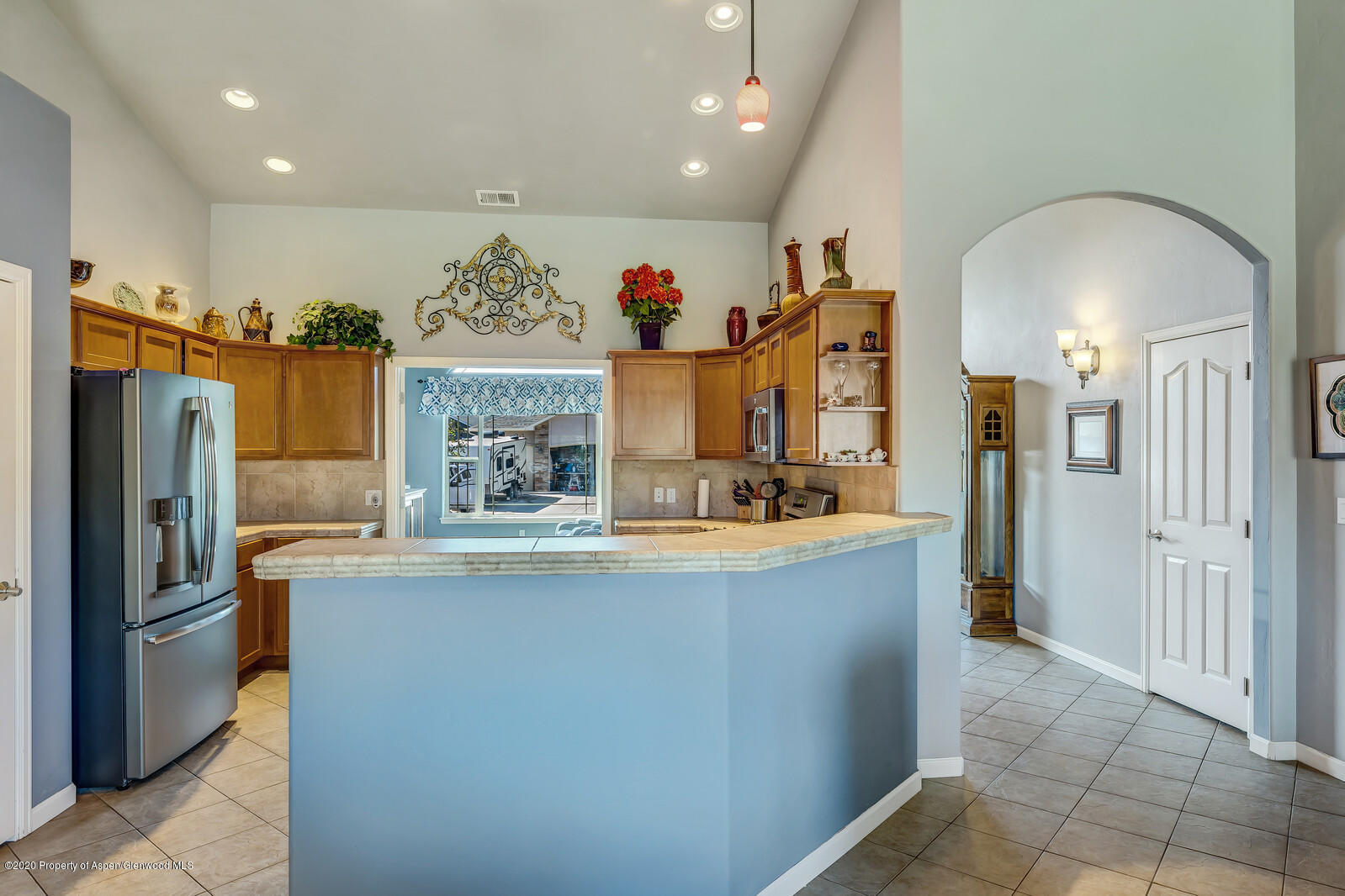 952 East 18th Street Rifle, CO 81650 - Photo 13 of 26 a kitchen with stainless steel appliances granite countertop a refrigerator a sink and a stove
