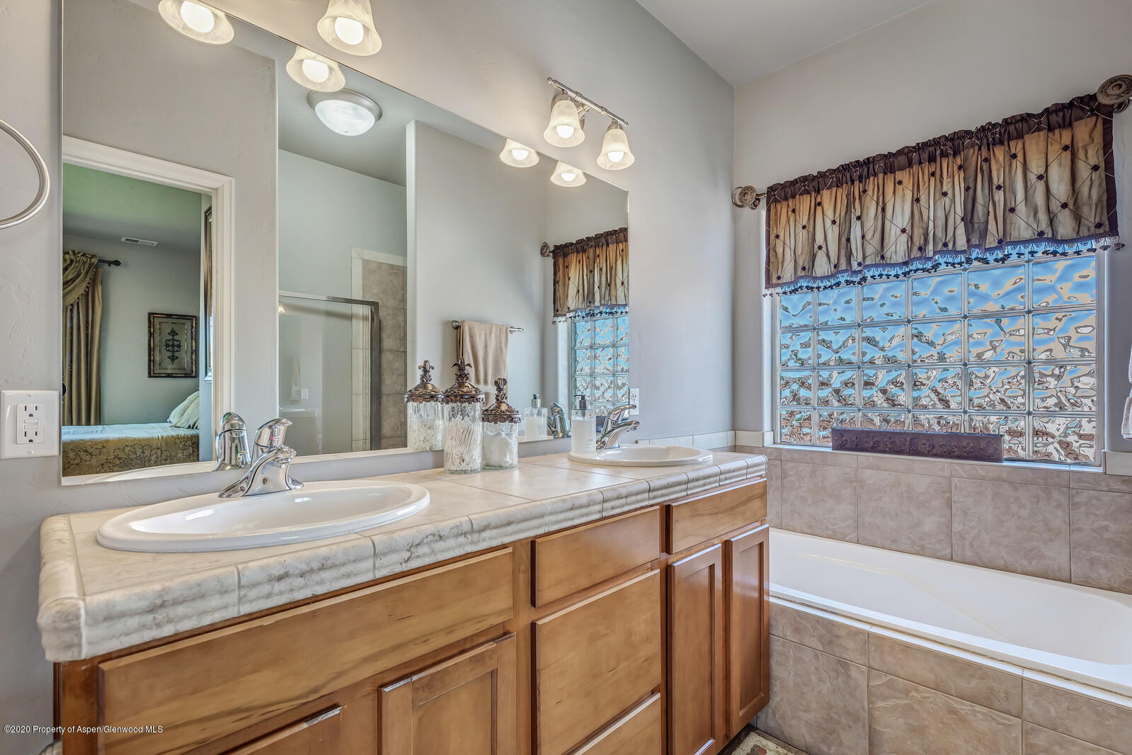 952 East 18th Street Rifle, CO 81650 - Photo 18 of 26 a bathroom with double vanity sink and a mirror