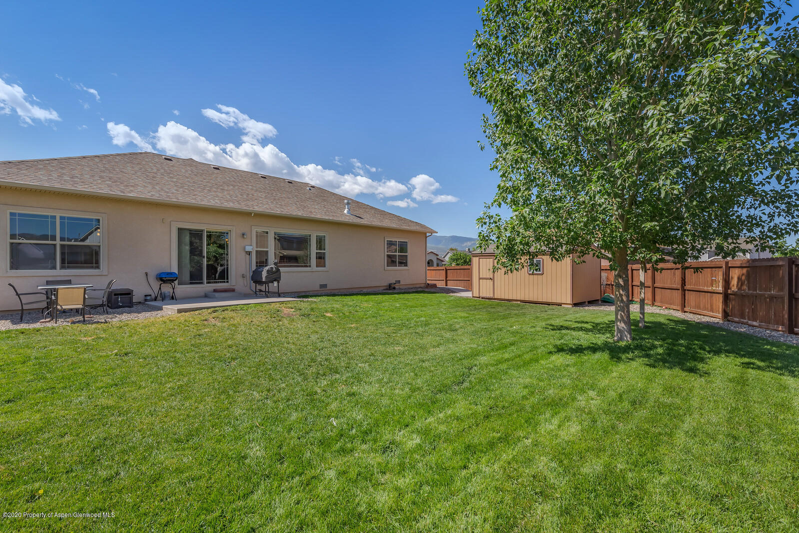 952 East 18th Street Rifle, CO 81650 - Photo 24 of 26 a view of a house with a backyard