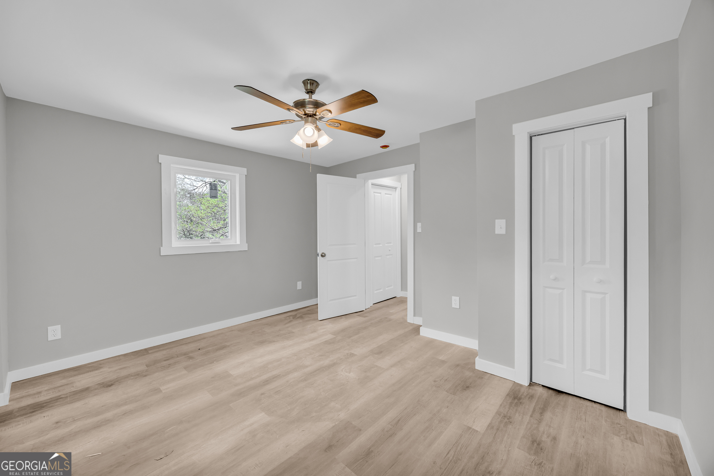 8606 Holly Springs Road Maysville, GA 30558 - Photo 61 of 74 a view of an empty room with a window