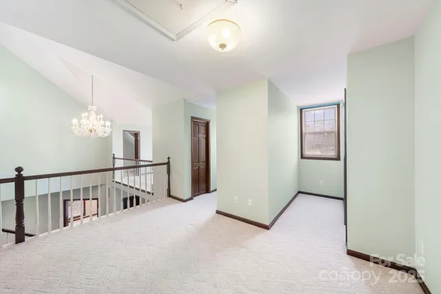 a view of a hallway with windows