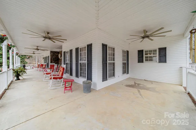 a view of a livingroom with a ceiling fan and a ceiling fan