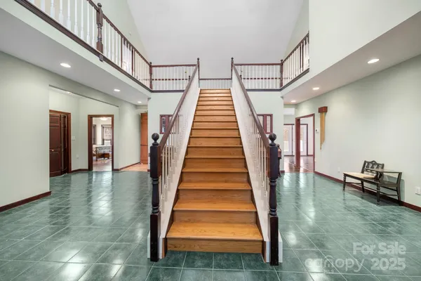 a view of staircase with white walls