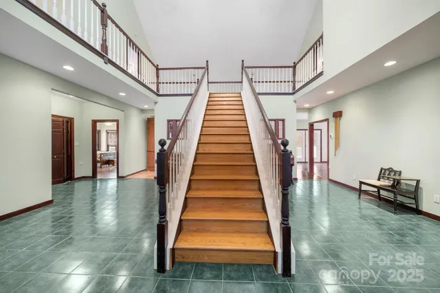 a view of staircase with white walls