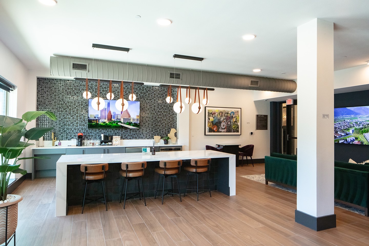3100 Scofield Ridge Parkway, Unit 2306 Austin, TX 78727 - Photo 20 of 21 Bar with tasteful backsplash, light wood-type flooring, visible vents, and hanging light fixtures