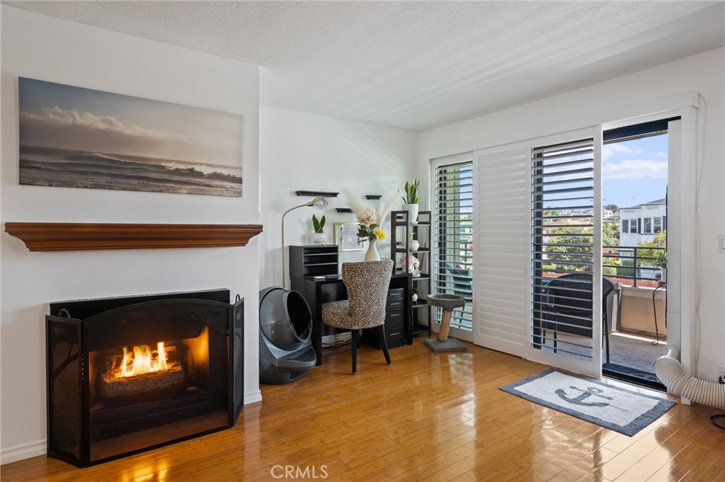 a workspace with furniture and a fireplace