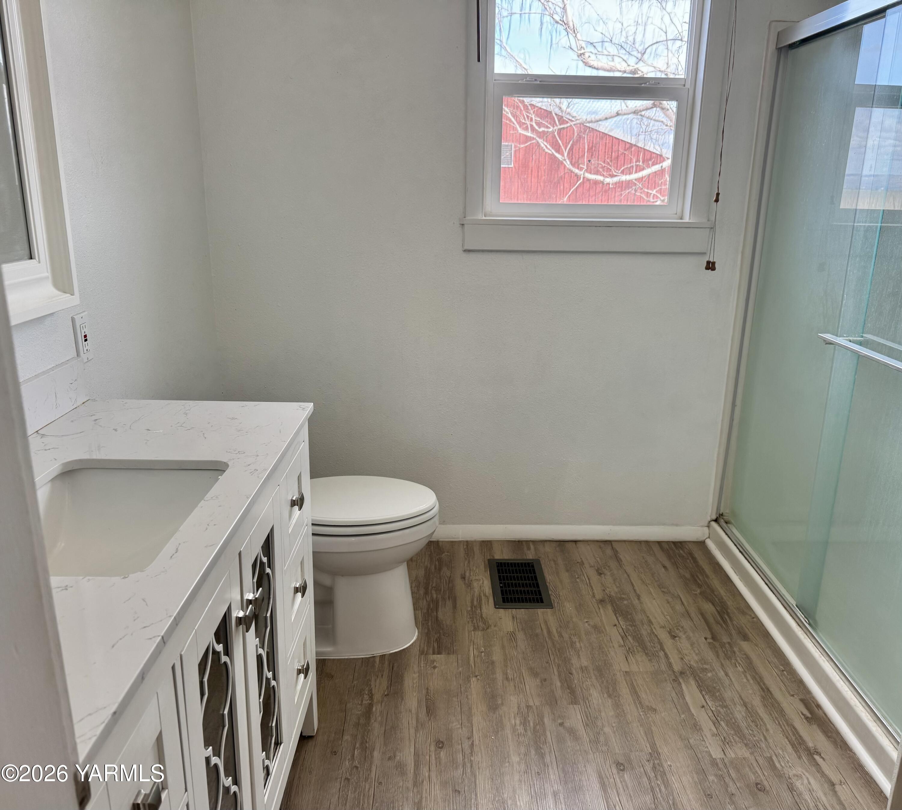 7801 Campbell Road, Unit 1 Toppenish, WA 98948 - Photo 26 of 46 a bathroom with a toilet and a sink