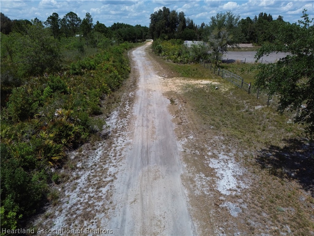 900 Ranchette Drive Lorida, FL 33857 - Photo 2 of 7 a view of a yard with a lake view
