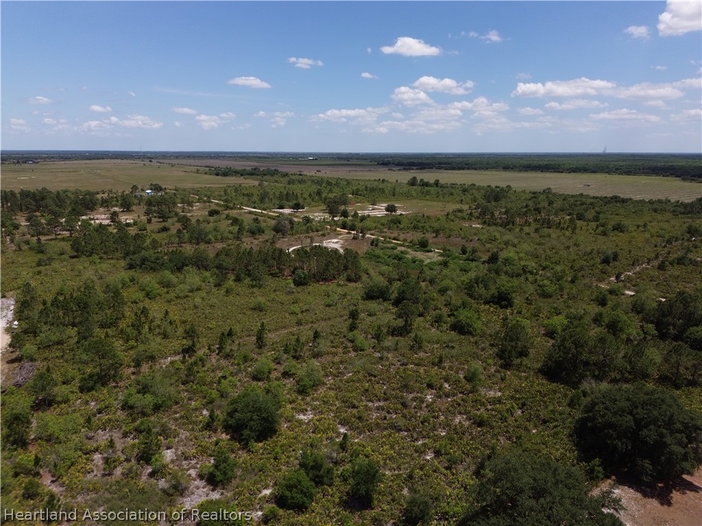 900 Ranchette Drive Lorida, FL 33857 - Photo 3 of 7 a view of an ocean and a yard