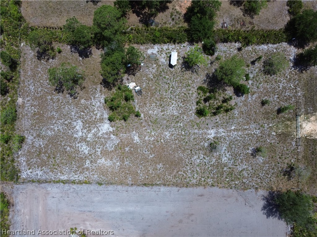 900 Ranchette Drive Lorida, FL 33857 - Photo 6 of 7 an aerial view of a house with a yard