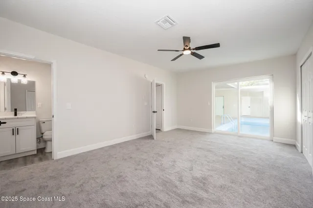 a view of an empty room with a bathroom