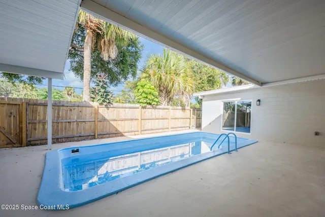 a view of a living room and floor to ceiling window