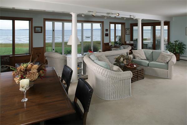 56 Massasoit Road Duxbury, MA 02332 - Photo 2 of 23 a living room with furniture and large windows