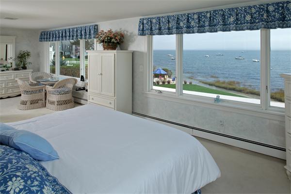 56 Massasoit Road Duxbury, MA 02332 - Photo 7 of 23 a bedroom with a bed and a large window