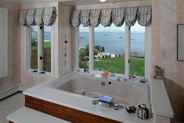56 Massasoit Road Duxbury, MA 02332 - Photo 8 of 23 a bathroom with a bathtub and a shower