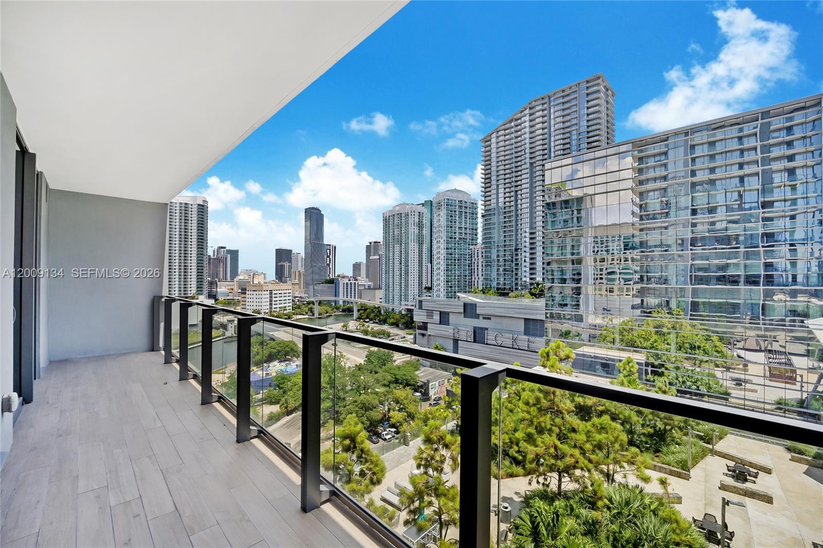 88 Southwest 7th Street, Unit 1009 Miami, FL 33130 - Photo 2 of 21 a view of swimming pool from a balcony