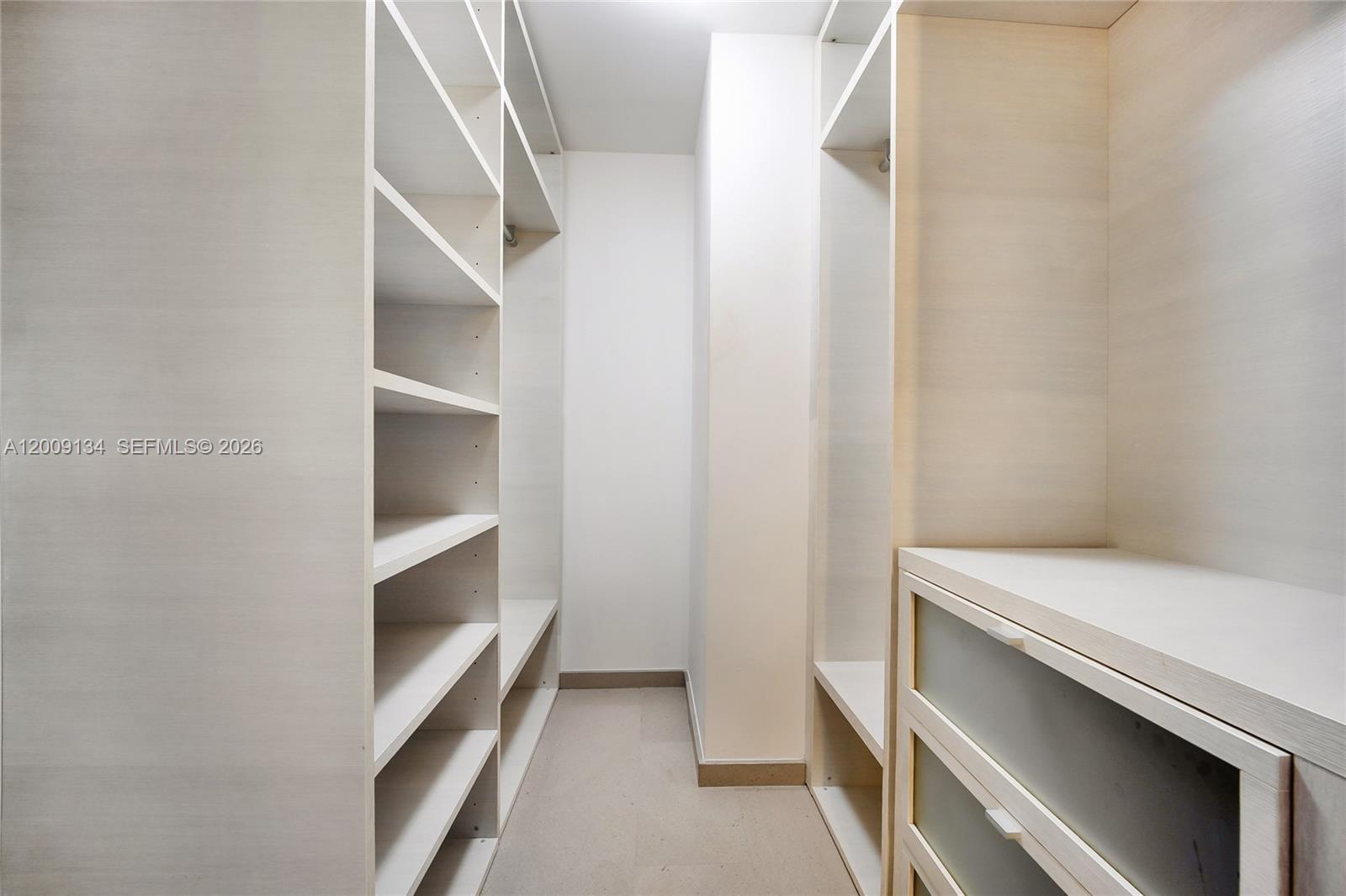 88 Southwest 7th Street, Unit 1009 Miami, FL 33130 - Photo 7 of 21 a view of an empty walk in closet