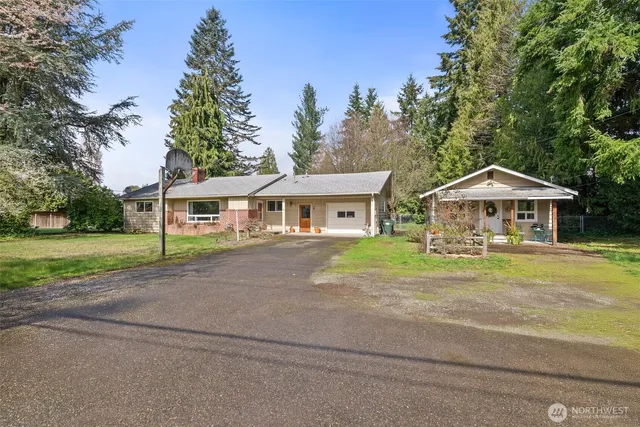 a front view of house with yard and green space