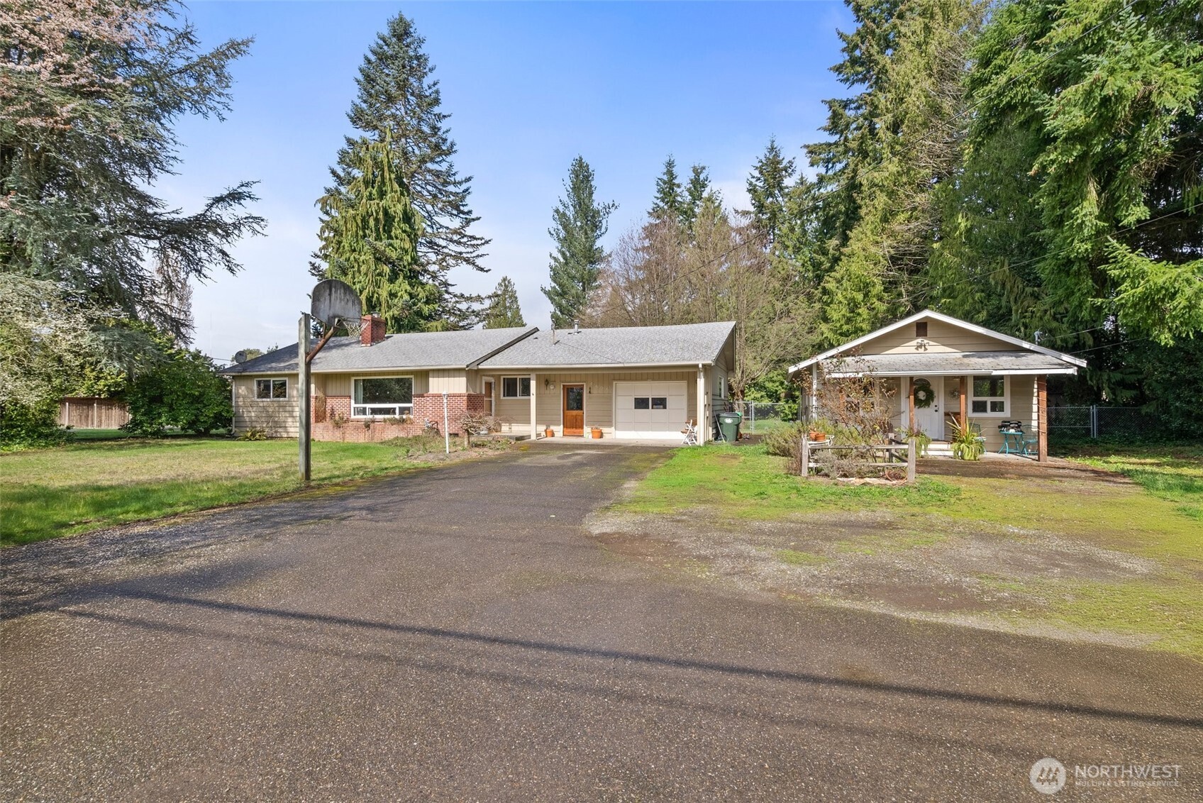a front view of house with yard and green space