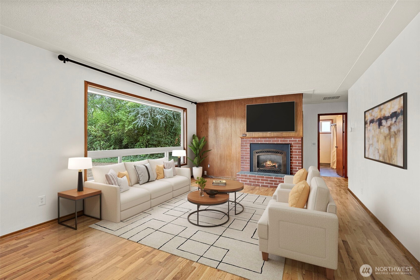4606 15th Avenue Northeast Olympia, WA 98516 - Photo 4 of 17 a living room with furniture large window and a fireplace