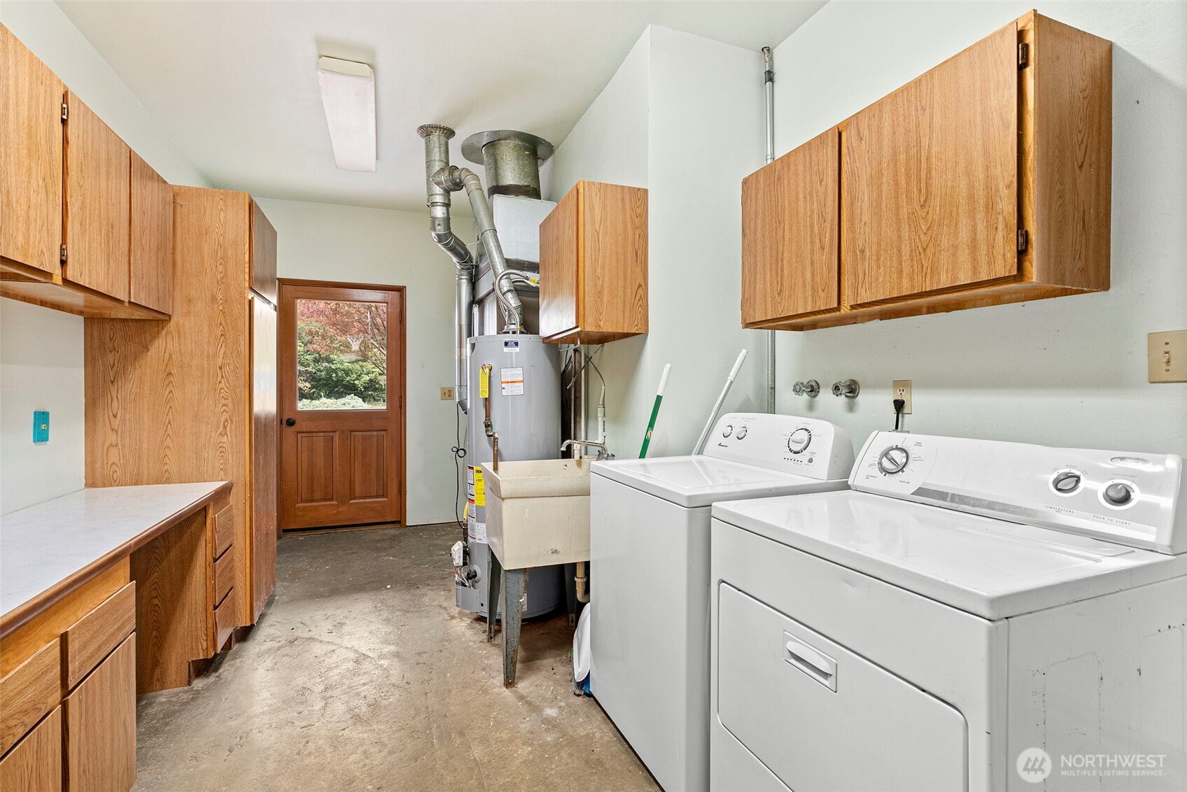 4606 15th Avenue Northeast Olympia, WA 98516 - Photo 9 of 17 a utility room with dryer and washer