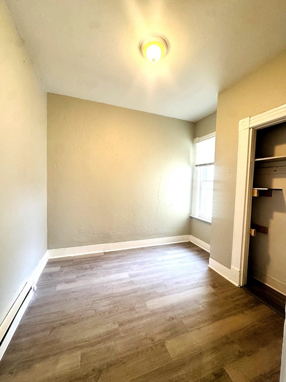 738 Central Street, Unit 2 Lowell, MA 01852 - Photo 5 of 11 a view of an empty room and window