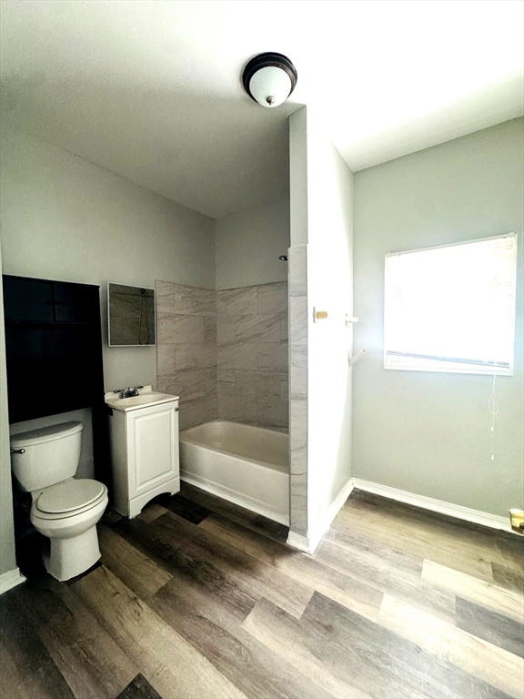 738 Central Street, Unit 2 Lowell, MA 01852 - Photo 8 of 11 a bathroom with a toilet and a shower