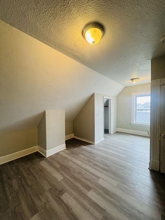 738 Central Street, Unit 2 Lowell, MA 01852 - Photo 9 of 11 a view of empty room with wooden floor