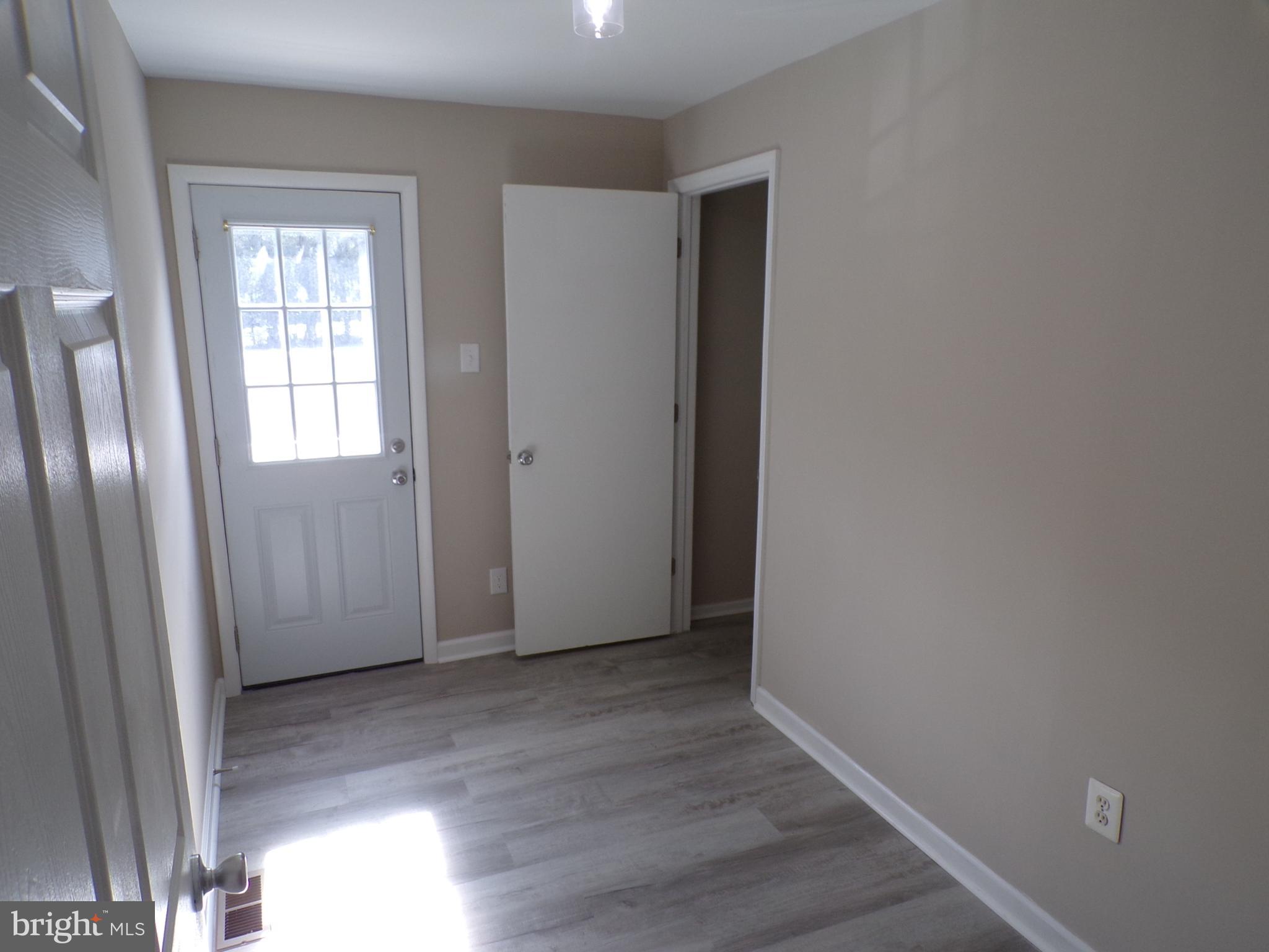 2452 Hopewell Road, Unit B Marlton, NJ 08053 - Photo 11 of 15 an empty room with wooden floor and windows