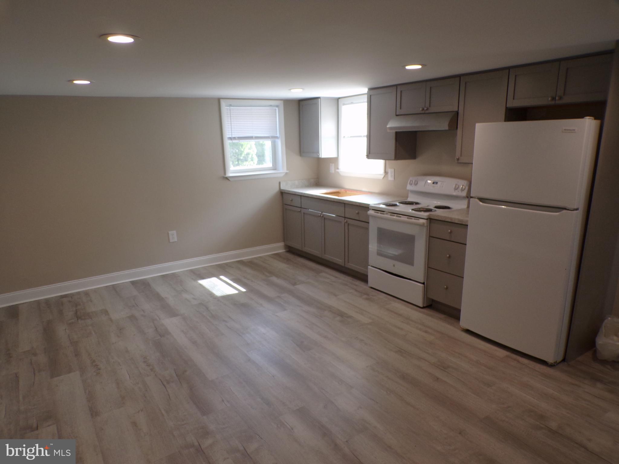 2452 Hopewell Road, Unit B Marlton, NJ 08053 - Photo 4 of 15 a kitchen with granite countertop a refrigerator and a stove top oven