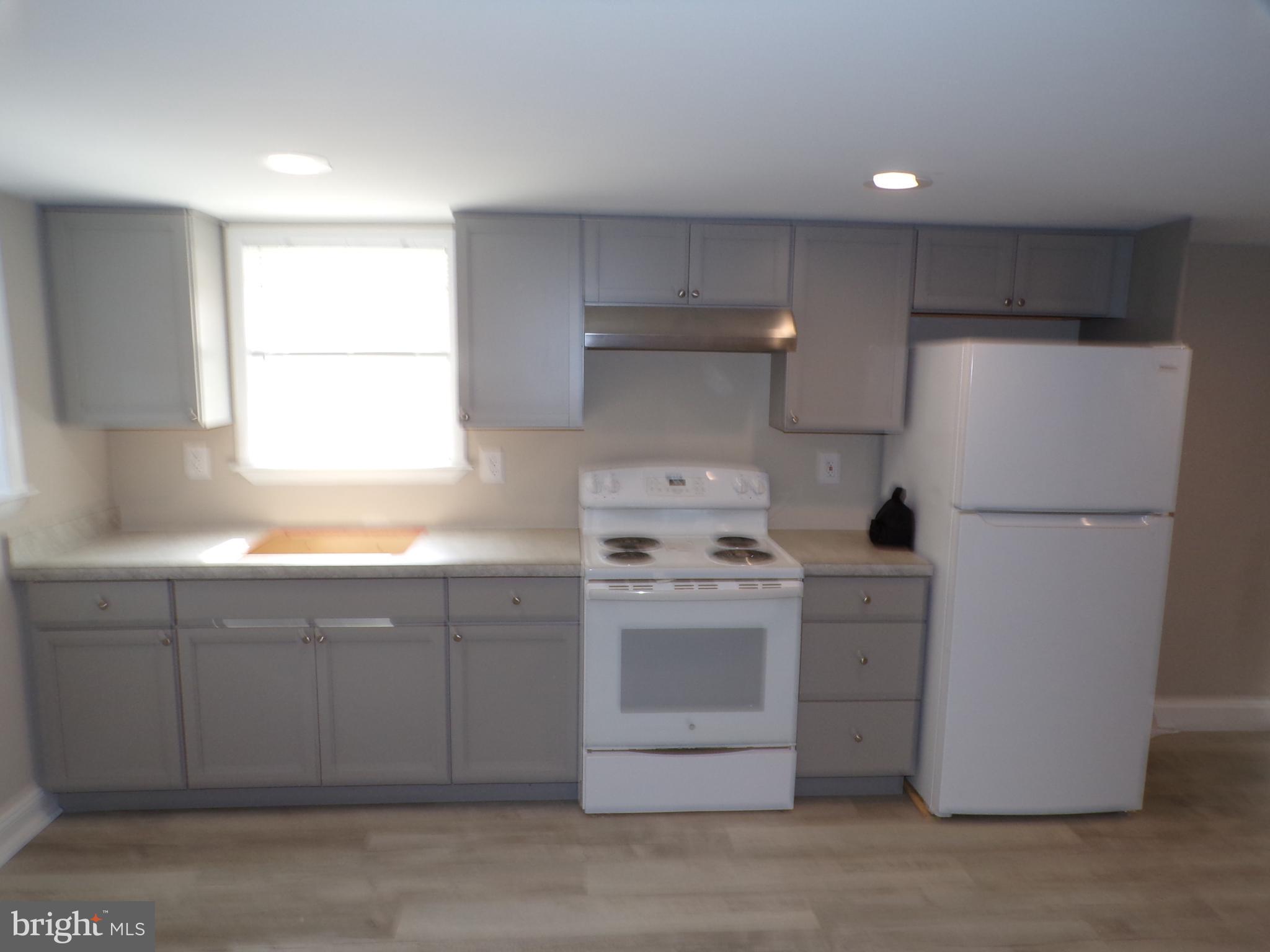 2452 Hopewell Road, Unit B Marlton, NJ 08053 - Photo 5 of 15 a kitchen with a refrigerator sink stove and cabinets